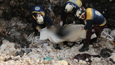 A charred body of a woman was found in a garbage dump in Idlib